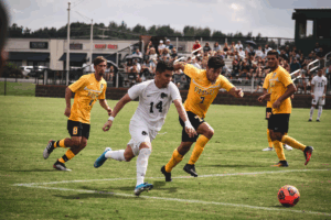 Youth soccer players dribbling