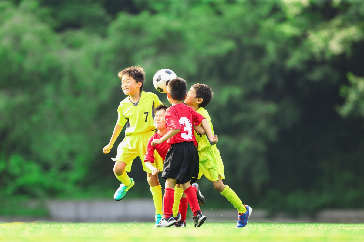 youth soccer competing for the ball
