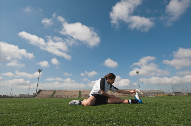 soccer player stretching exercise